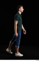  Trent  1 blue jeans casual dressed green t shirt side view walking white sneakers whole body 0002.jpg